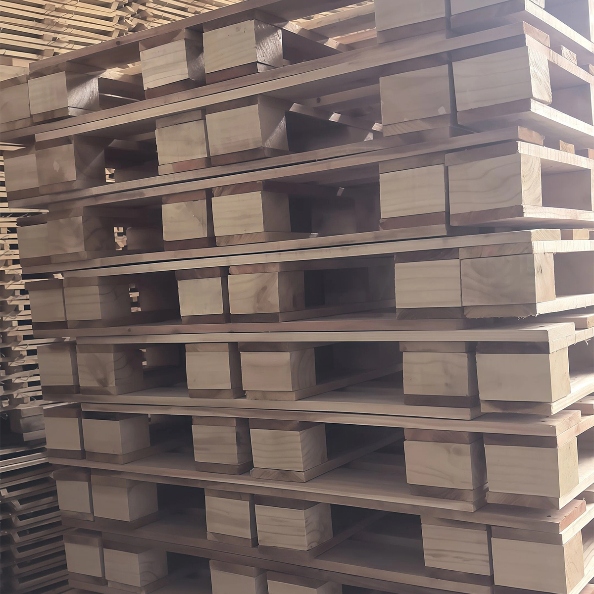 Close-up of sawn timber blocks used in solid wooden pallet assembly